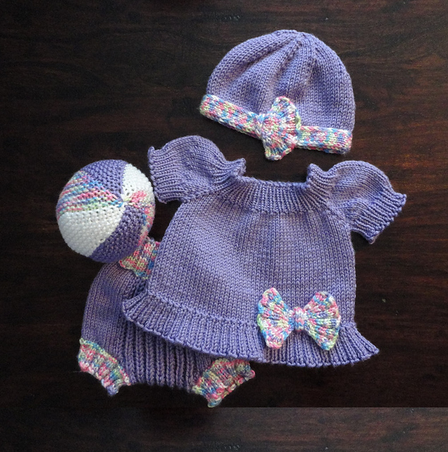 Free knitting patterns for baby set with dress, diaper cover, ball, and hat