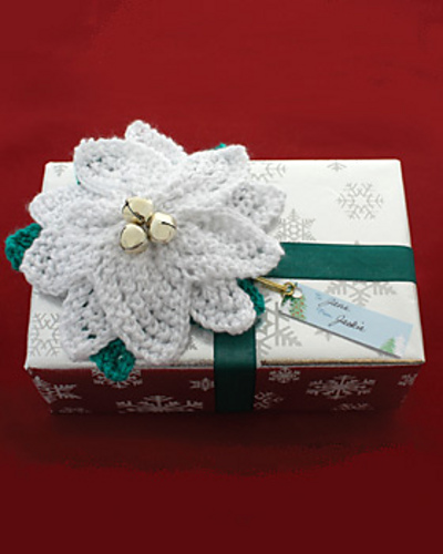 Free knitting pattern for Poinsettia Gift Topper and more gift wrap knitting patterns