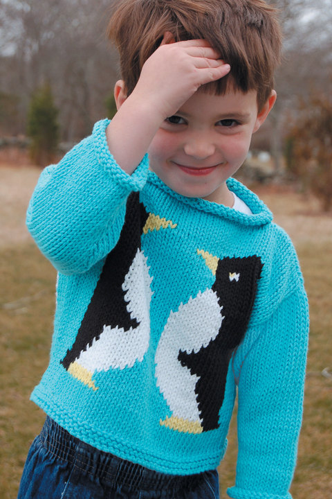 Knitting pattern for child's pullover sweater with two penguins